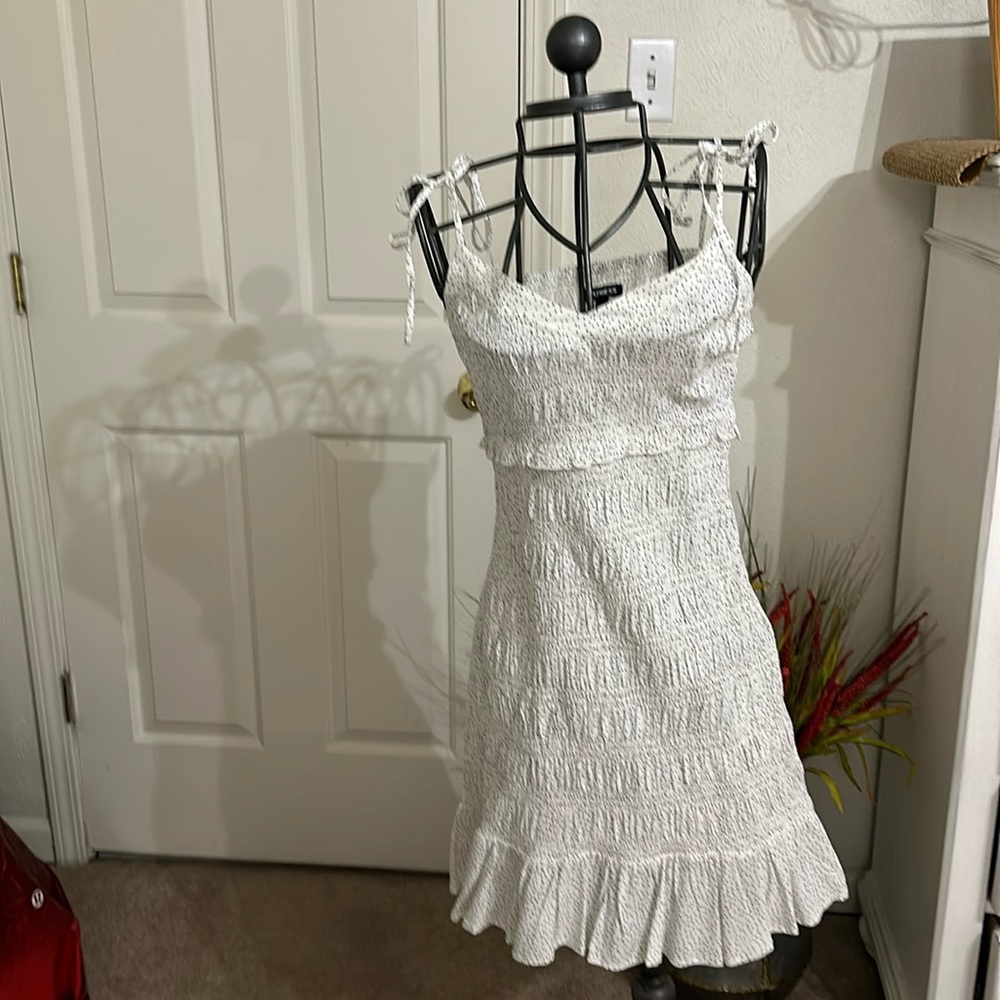 While polka dot dress. Brand new without tags